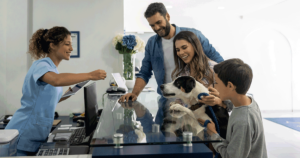 Veterinary clinic front desk with family